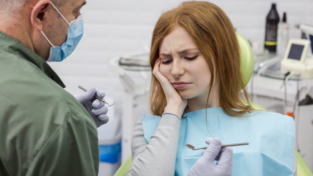 Woman suffering from toothache - Dental problem.