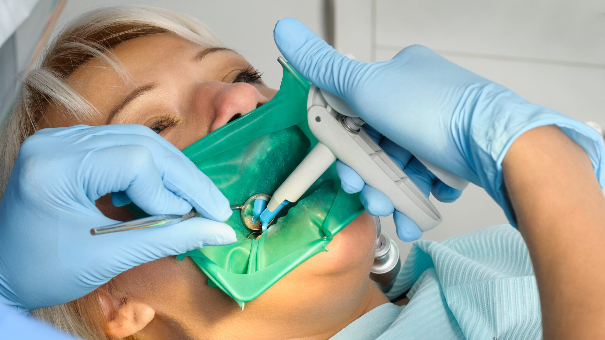 dentist with patient, cleaning and curing