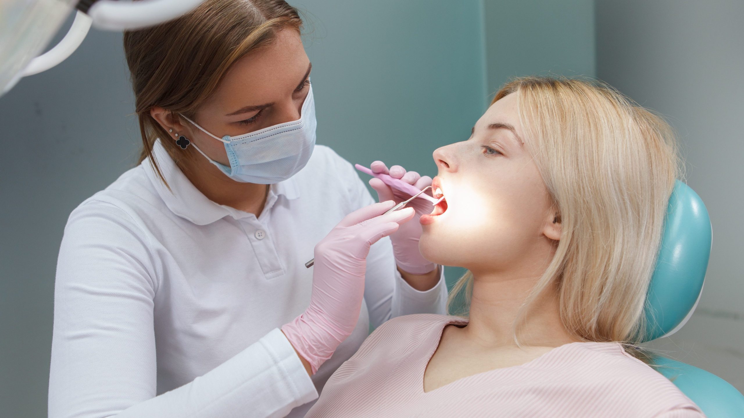 Lovely young woman having dental examination