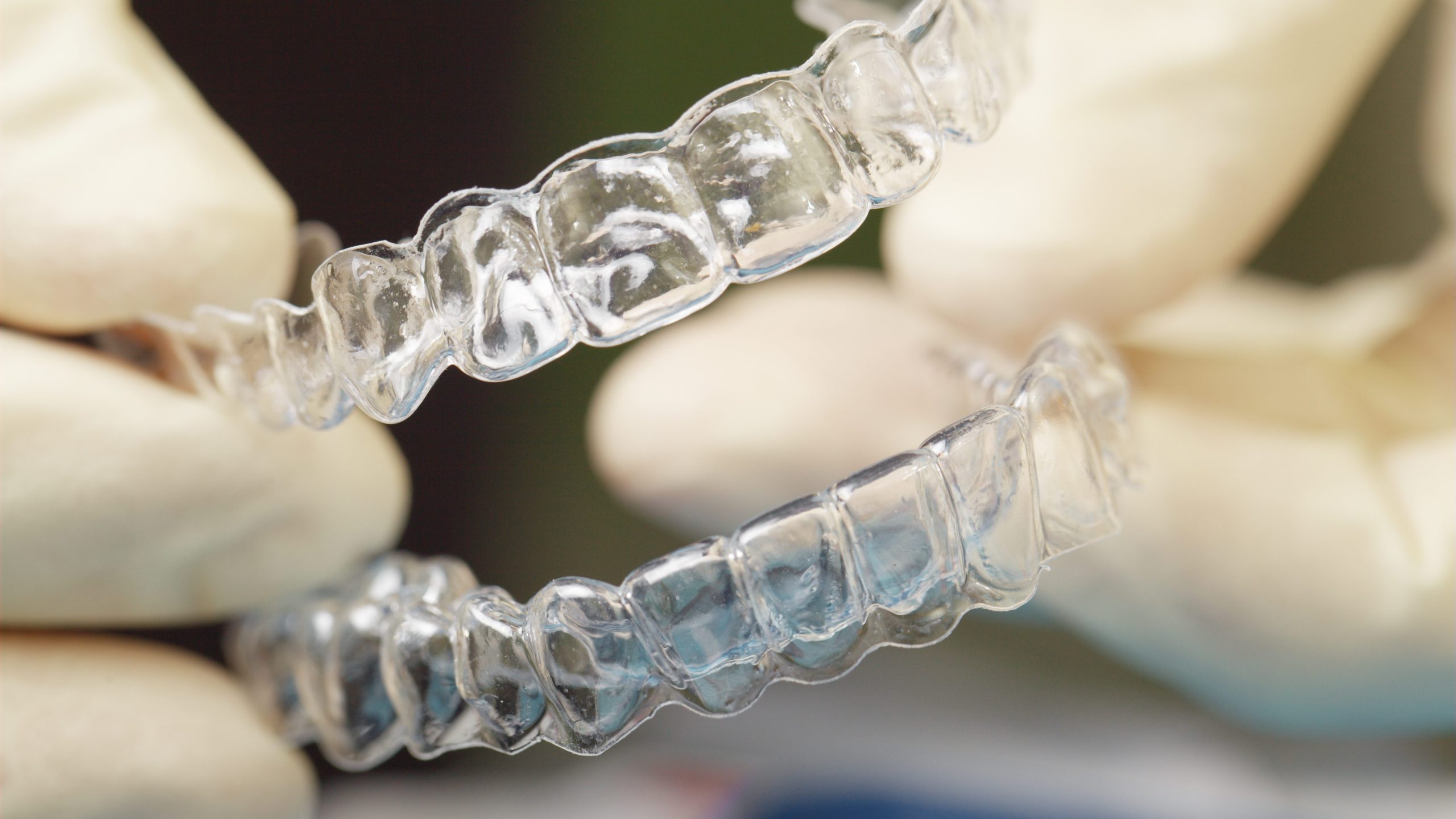 Doctors hands holding silicone mouth guard